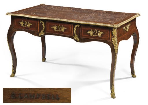 A FRENCH ORMOLU MOUNTED MAHOGANY AND TULIPWOOD BUREAU PLAT