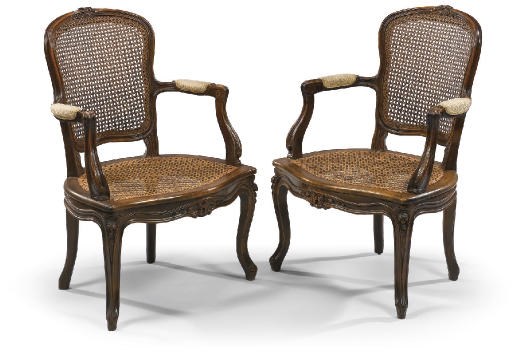 A PAIR OF NORTH ITALIAN WALNUT AND CANED FAUTEUILS