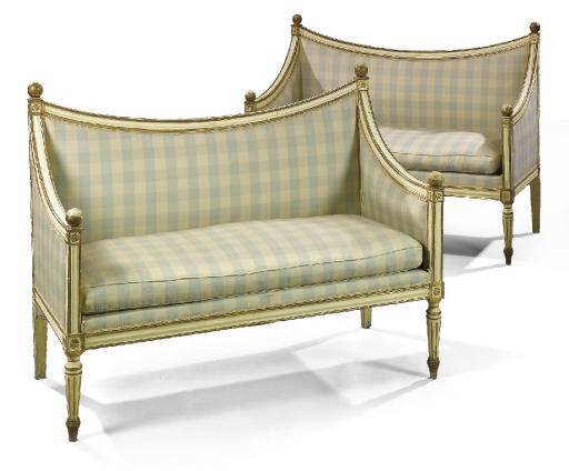 A PAIR OF NORTH ITALIAN CREAM PAINTED AND PARCEL-GILT SOFAS