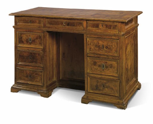 A NORTH ITALIAN WALNUT AND BURR WALNUT KNEEHOLE DESK