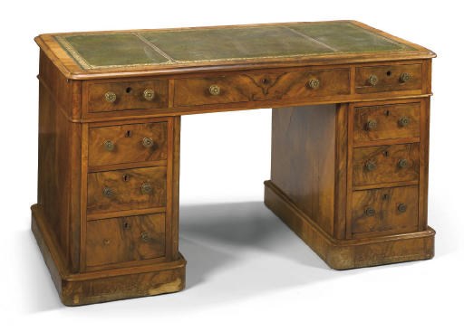 AN EARLY VICTORIAN WALNUT PEDESTAL DESK