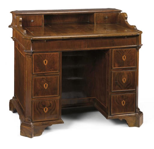 AN ITALIAN WALNUT AND FRUITWOOD BANDED KNEEHOLE DESK