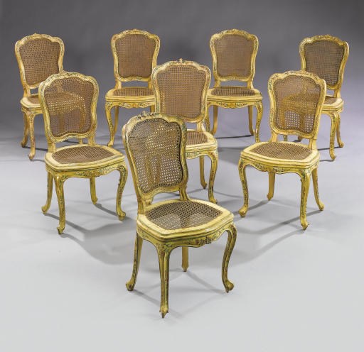 A SET OF TWELVE VENETIAN POLYCHROME DECORATED, PARCEL-GILT AND CANED SIDE CHAIRS