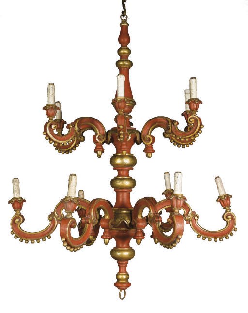 AN ITALIAN RED PAINTED AND PARCEL-GILT TWELVE LIGHT CHANDELIER