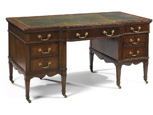 A LATE VICTORIAN MAHOGANY KNEEHOLE DESK