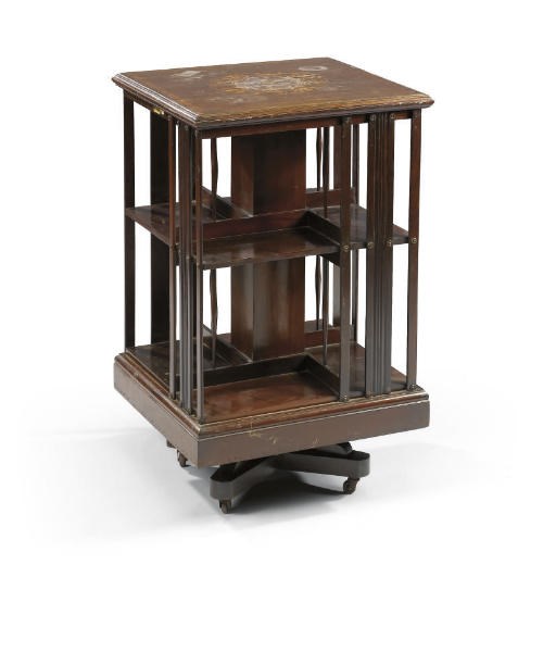 AN EDWARDIAN MAHOGANY AND MARQUETRY REVOLVING BOOKCASE
