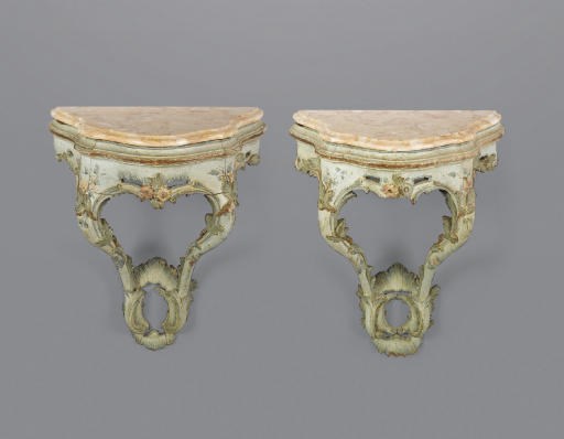 A PAIR OF VENETIAN POLYCHROME DECORATED AND MARBLE SERPENTINE CONSOLES