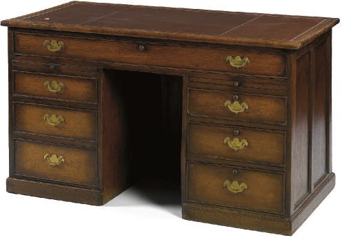 A VICTORIAN OAK KNEEHOLE DESK