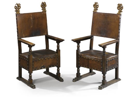 A SET OF THREE NORTH ITALIAN WALNUT AND PARCEL-GILT ARMCHAIRES