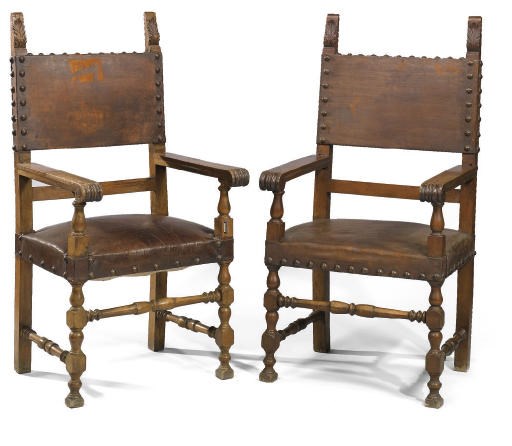 A PAIR OF ITALIAN WALNUT AND LEATHER UPHOLSTERED ARMCHAIRS