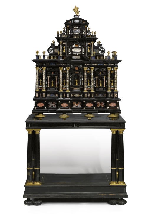 AN ITALIAN ORMOLU MOUNTED EBONY, PIETRA DURA AND MOTHER-OF-PEARL INLAID CABINET