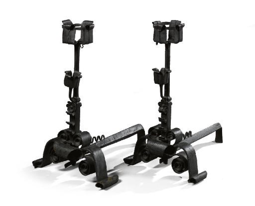 A PAIR OF WROUGHT IRON FIRE DOGS