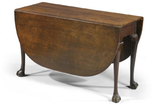 A GEORGE III MAHOGANY DROP-LEAF DINING TABLE