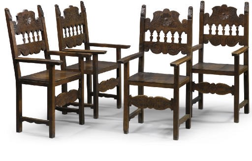 A SET OF FOUR ITALIAN WALNUT ARMCHAIRS