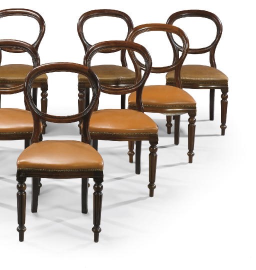 A SET OF NINE MAHOGANY BALLOON-BACK DINING CHAIRS
