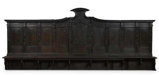 AN ITALIAN WALNUT CHOIR STALL