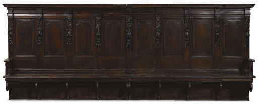 AN ITALIAN WALNUT CHOIR STALL