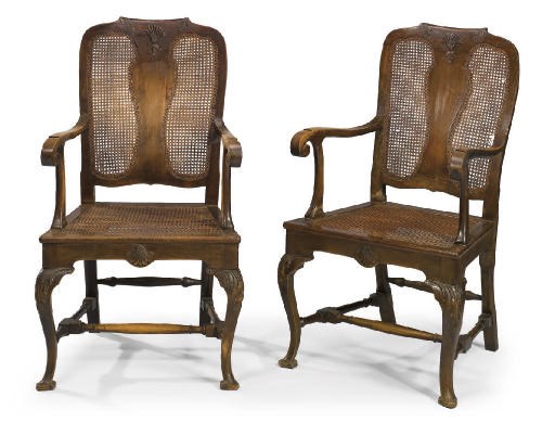 A PAIR OF WALNUT AND CANED ARMCHAIRS