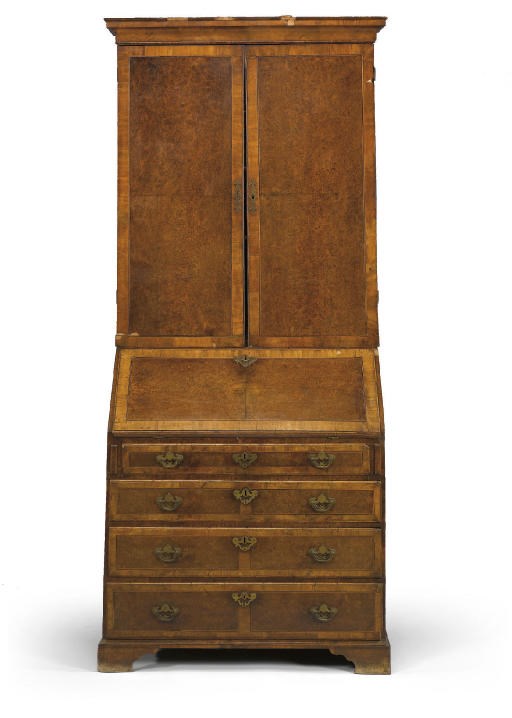 A GEORGE II BURR YEW AND WALNUT BUREAU CABINET