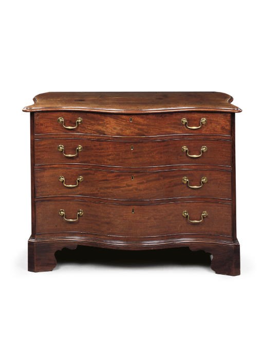 AN EARLY GEORGE III MAHOGANY SERPENTINE DRESSING-CHEST