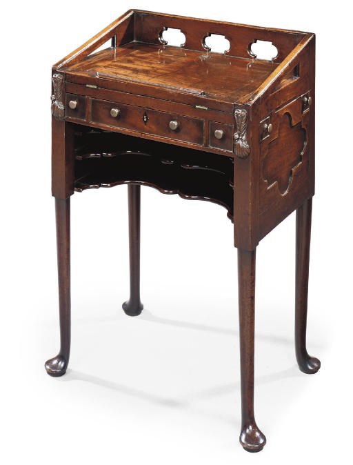 A GEORGE II MAHOGANY WRITING-TABLE