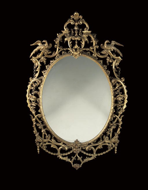 A LATE VICTORIAN GILTWOOD MIRROR