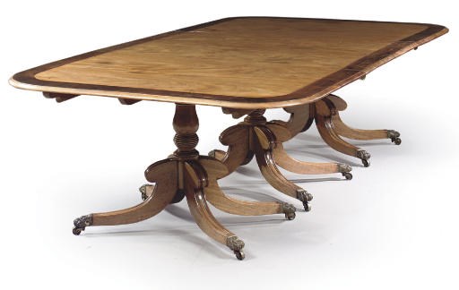 A REGENCY MAHOGANY AND EBONISED DINING-TABLE