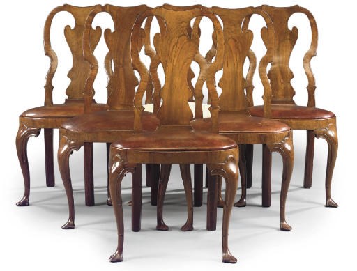 A SET OF SIX IRISH GEORGE I WALNUT SIDE CHAIRS