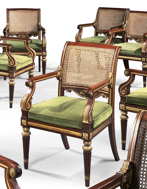A SET OF TWELVE REGENCY BRASS-MOUNTED AND PARCEL-GILT MAHOGANY ARMCHAIRS