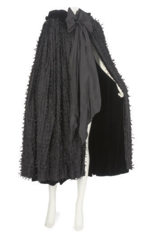 A BLACK SILK EVENING CAPE, 1950s