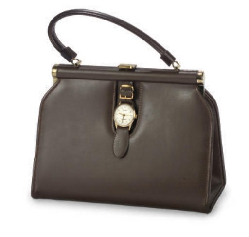A VINTAGE HANDBAG WITH WATCH