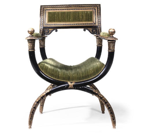 AN EMPIRE PARCEL-GILT AND BLACK-JAPANNED X-FRAMED OPEN ARMCHAIR