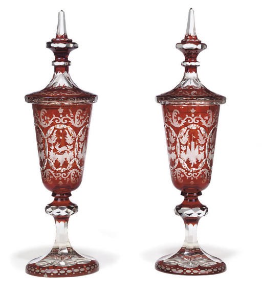 A PAIR OF CONTINENTAL RUBY FLASH TAPERING GOBLETS AND COVERS