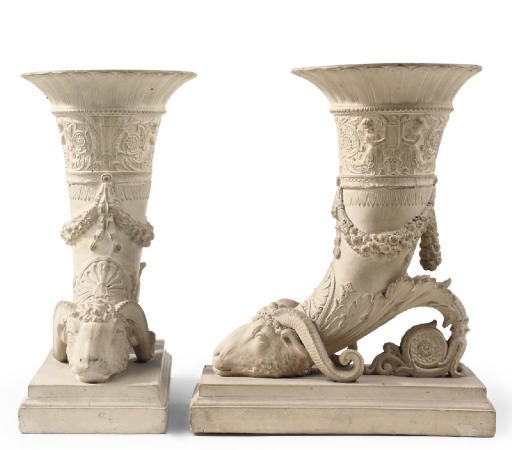 A PAIR OF PAINTED PLASTER RHYTONS