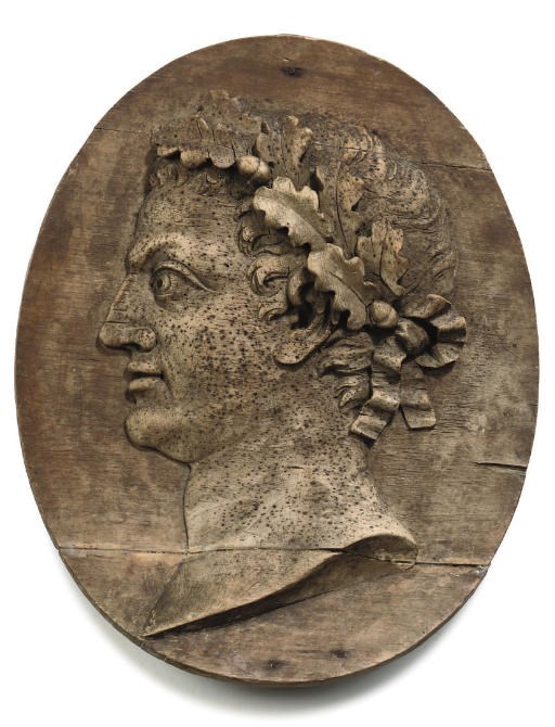 A RELIEF-CARVED LIMEWOOD OVAL PANEL