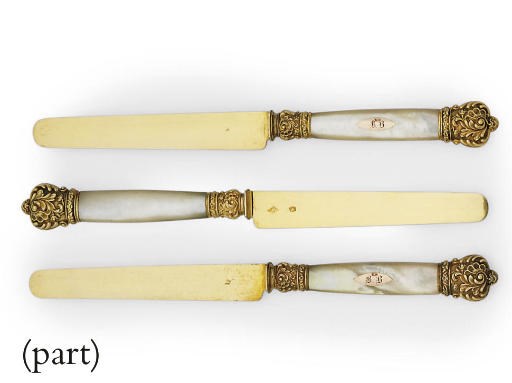 A SET OF EIGHTEEN FRENCH SILVER-GILT MOUNTED MOTHER-OF-PEARL FRUIT-KNIVES