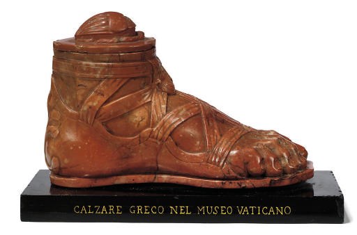 AN ITALIAN SCULPTED ROSSO VERONA MARBLE MODEL OF A FOOT
