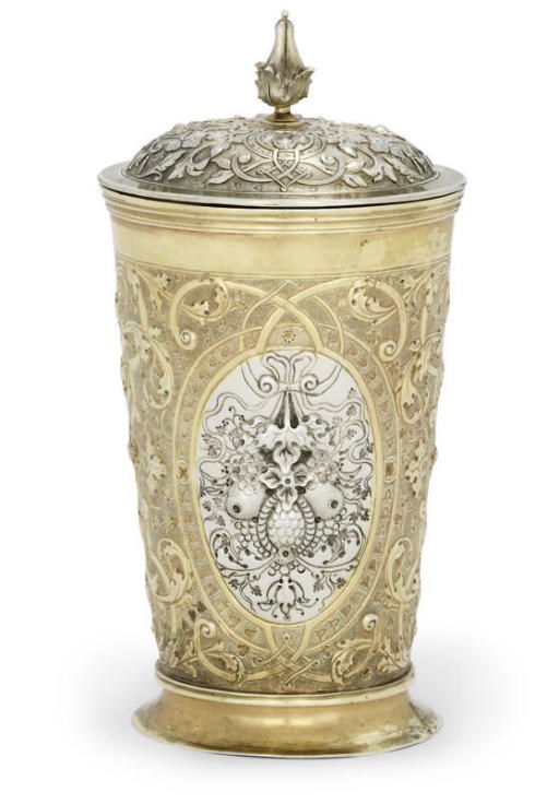 A PARCEL-GILT SILVER BEAKER AND COVER