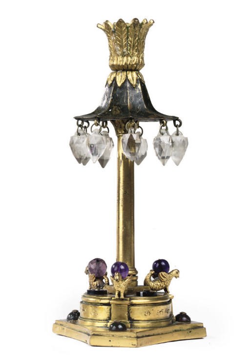 AN EMPIRE ORMOLU CANDLESTICK