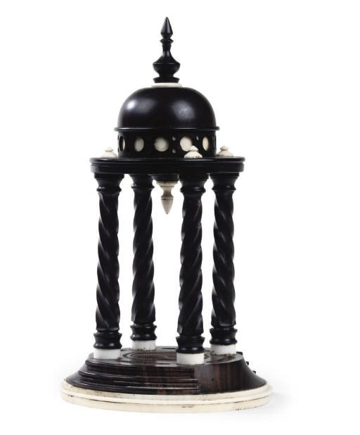 A VICTORIAN EBONY AND IVORY TABLE ORNAMENT