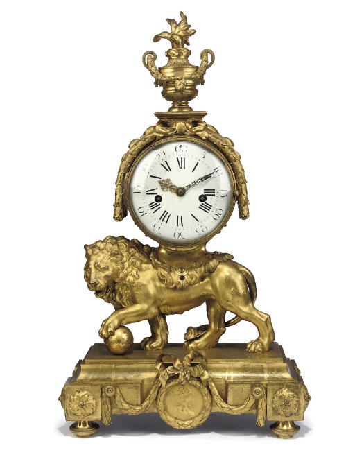 A LOUIS XVI ORMOLU STRIKING LION CLOCK