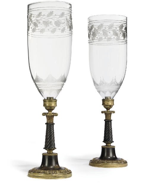 A PAIR OF REGENCY GILT AND PATINATED BRONZE CANDLESTICKS