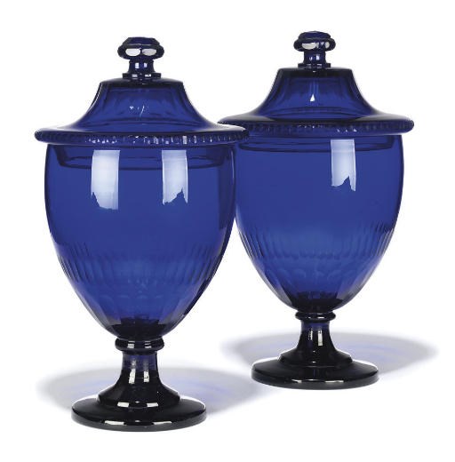 A PAIR OF CONTINENTAL BLUE GLASS VASES AND COVERS