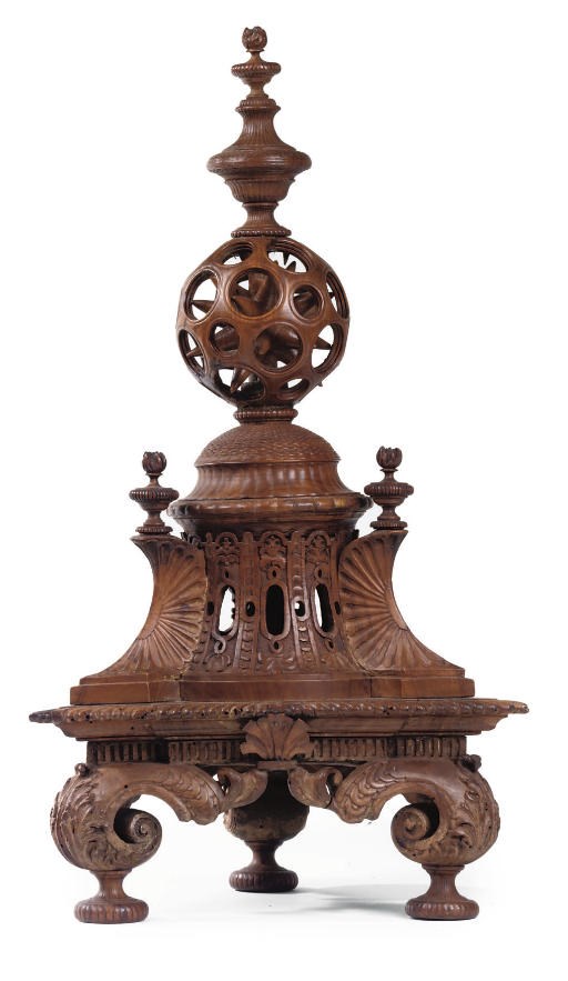 AN ITALIAN WALNUT ORNAMENTAL CENTREPIECE