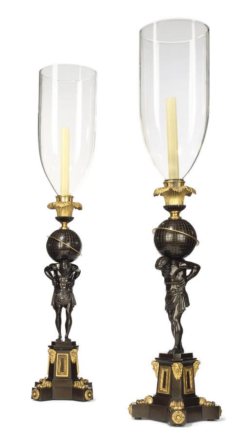A PAIR OF GILT AND PATINATED BRONZE CANDLESTICKS