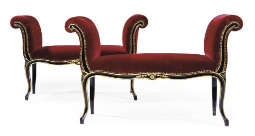 A PAIR OF GEORGE III EBONISED AND PARCEL-GILT MAHOGANY SERPENTINE WINDOW SEATS