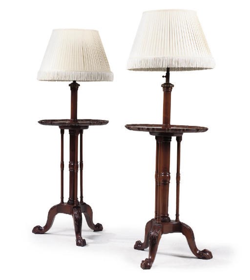 A PAIR OF MAHOGANY ADJUSTABLE LAMP TABLES