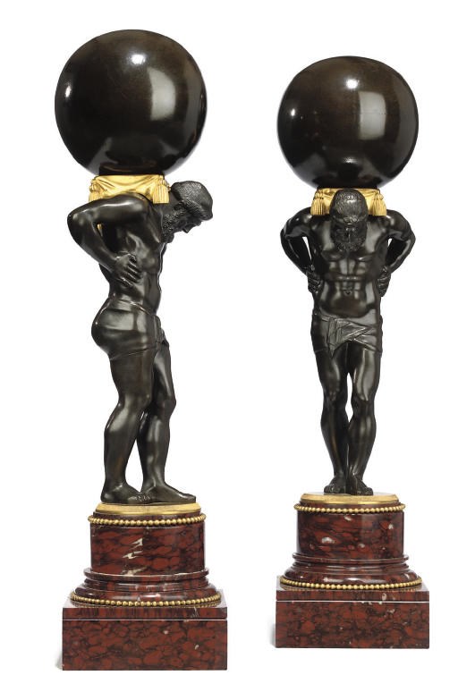 A PAIR OF GILT AND PATINATED BRONZE ATLAS FIGURES