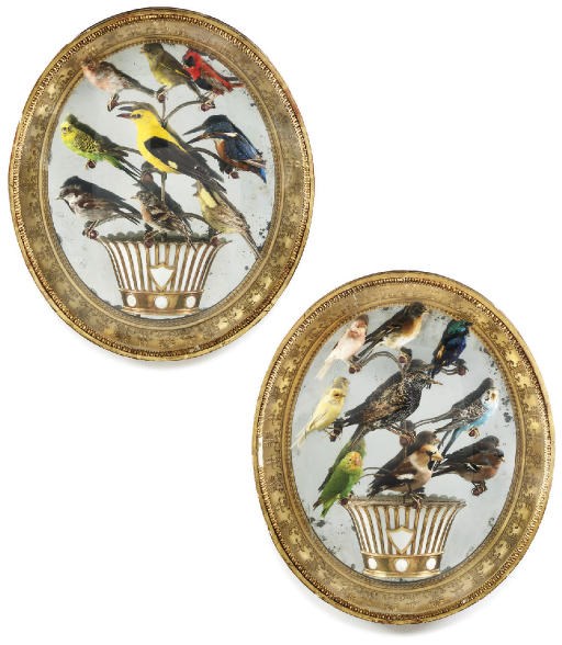 A PAIR OF FRENCH GILTWOOD AND COMPOSITION OVAL WALL DISPLAYS