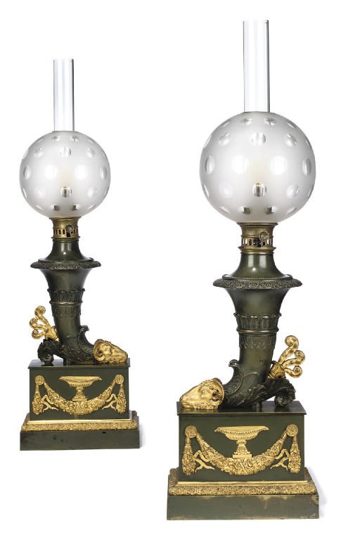 A PAIR OF CHARLES X ORMOLU AND BRONZE RHYTON LAMPS